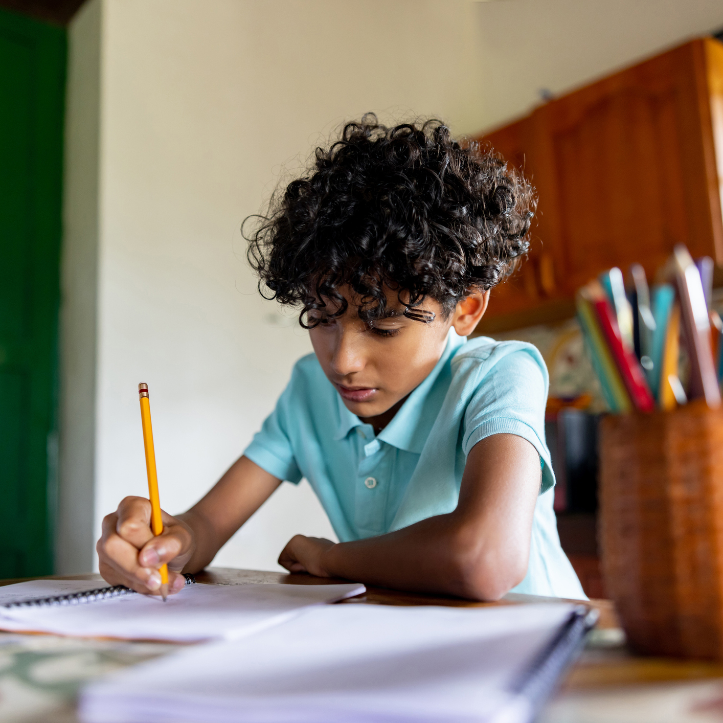 child seen studying on moving scooter 