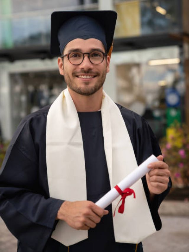 Portrait of a male student looking happy on graduation day - education concepts